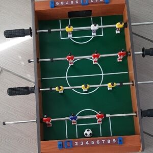 Tabletop Foosball Game with Green Field